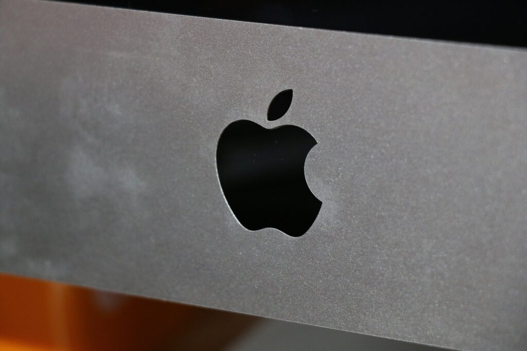 Mac computers in our hands